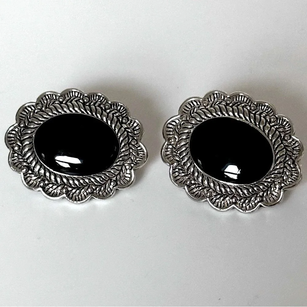 Vintage Sterling Silver Oval Clip-On Earrings with a black stone.